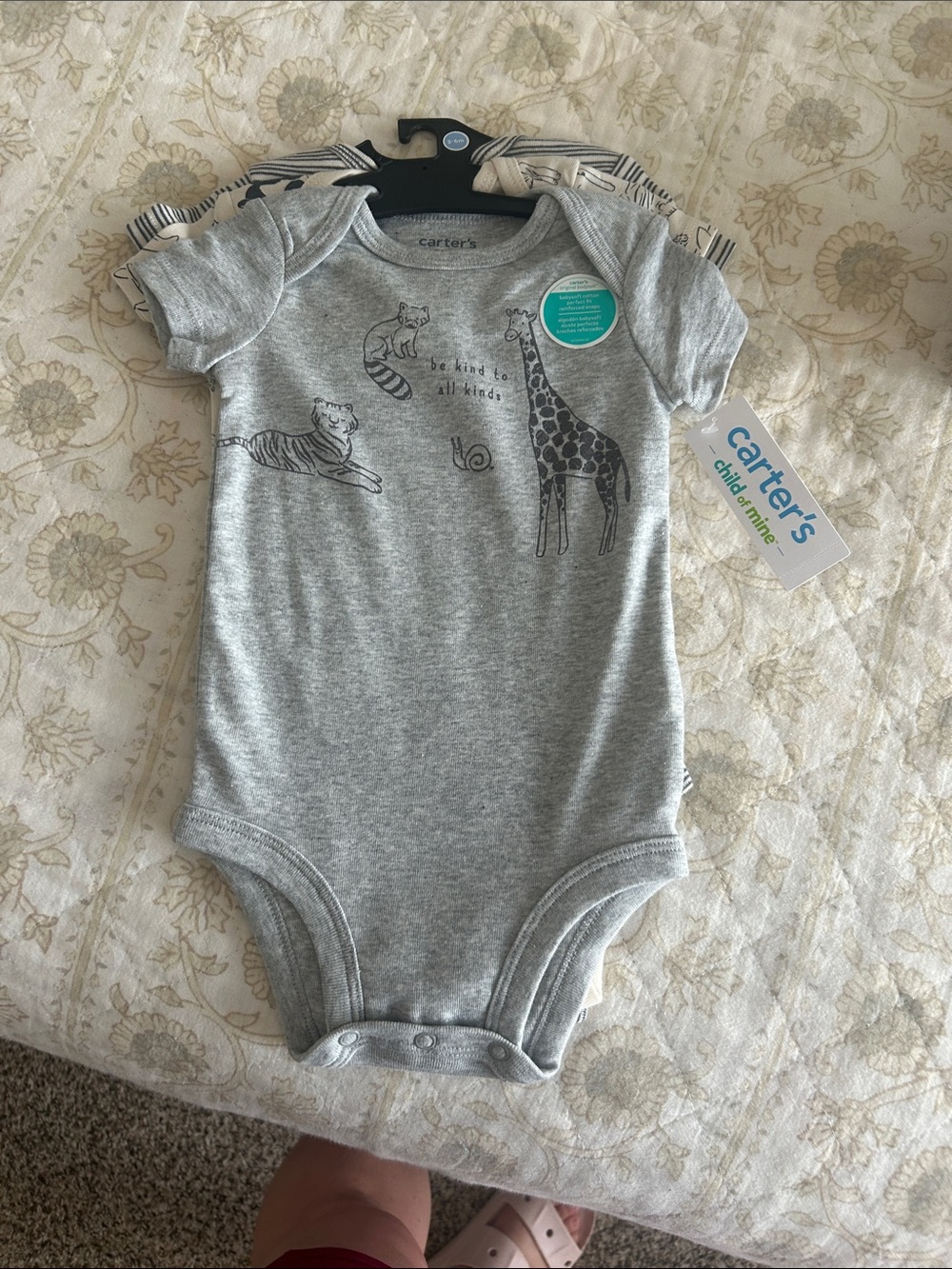 Three-piece Carter’s baby onesie set